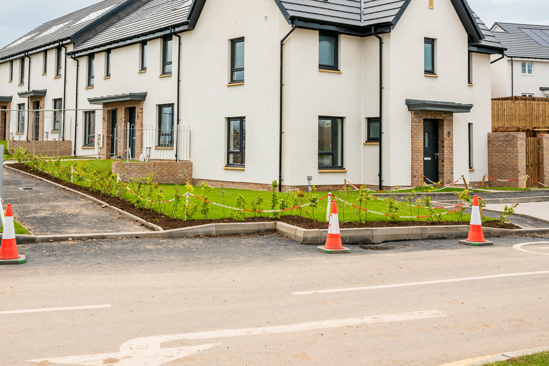 New build housing with dropped kerb and driveway access - typical use case for a 1:100 block plan