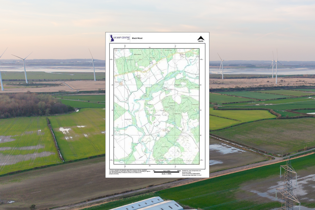 OS 1:5000 colour rural plan overlaid on aerial photograph of open farmland with wind turbines in the background