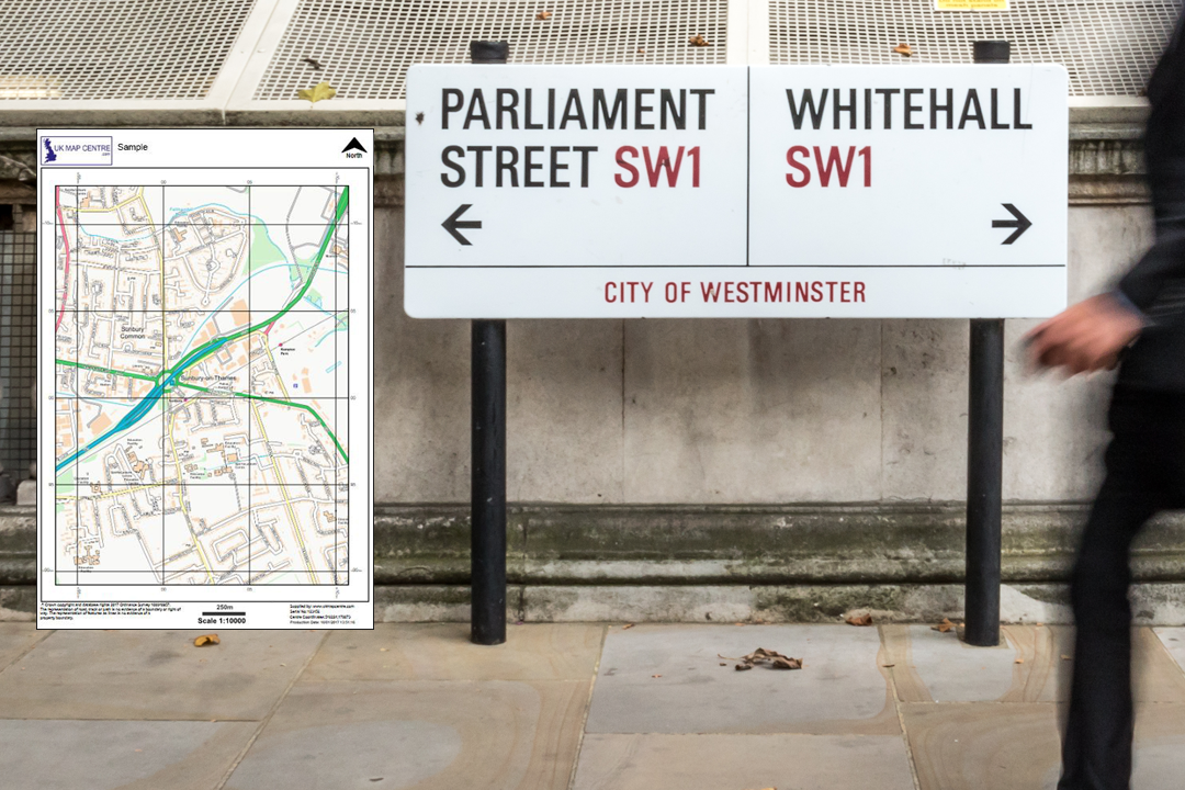 OS street map extract displayed on a wall next to Parliament Street and Whitehall SW1 signs in the City of Westminster - clear contextual mapping for offices and public buildings